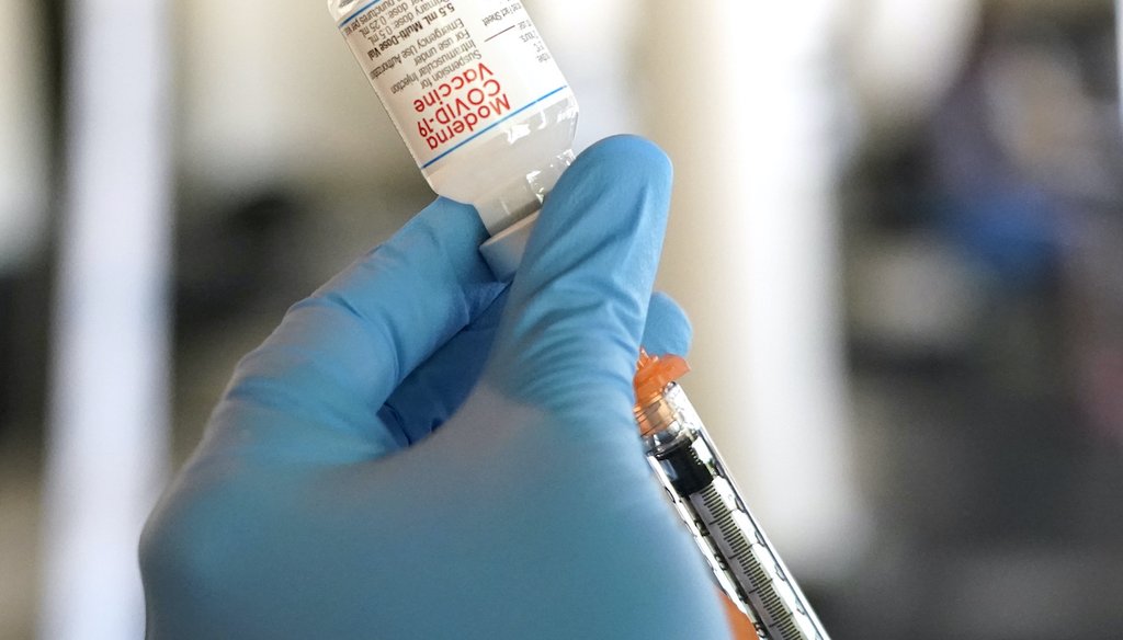 A Jackson-Hinds Comprehensive Health Center nurse loads a syringe with the Moderna COVID-19 vaccine at an inoculation station next to Jackson State University in Jackson, Miss., on July 19, 2022. (AP)