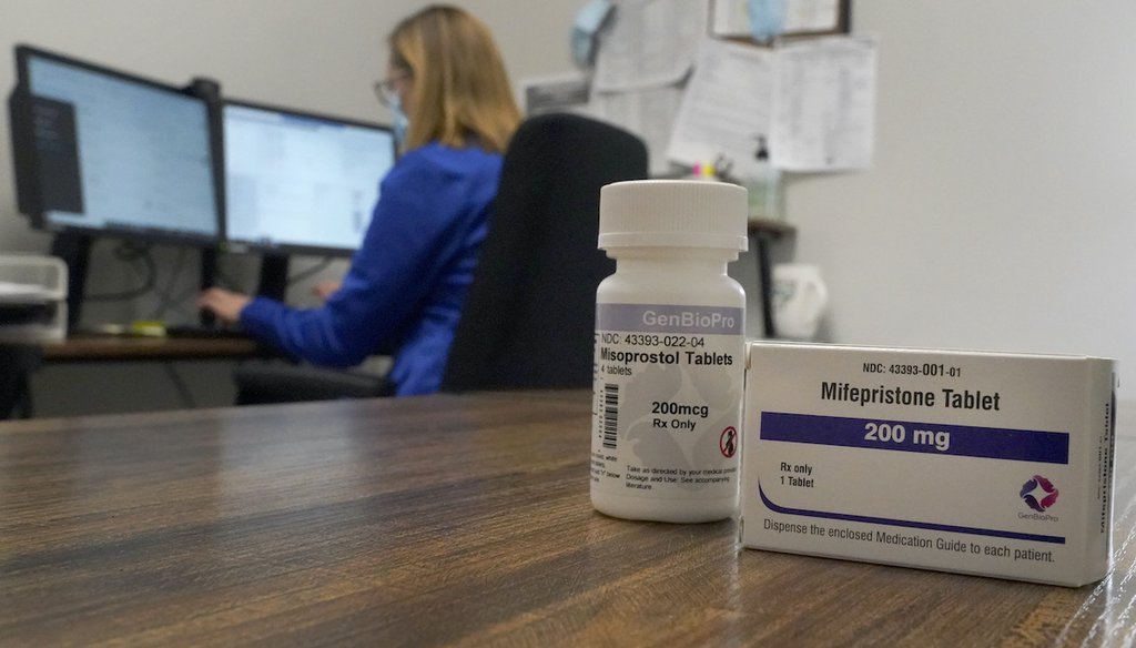 A nurse practitioner works at a Planned Parenthood clinic where she confers via teleconference with patients seeking self-managed abortions as containers of the medication used to end an early pregnancy sits on a table nearby Oct. 29, 2021. (AP)