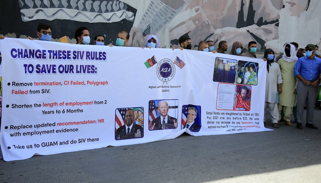 In this June 25, 2021 photo, former Afghan interpreters hold placards during a demonstrations against the US government, in front of the US Embassy in Kabul, Afghanistan. (AP)