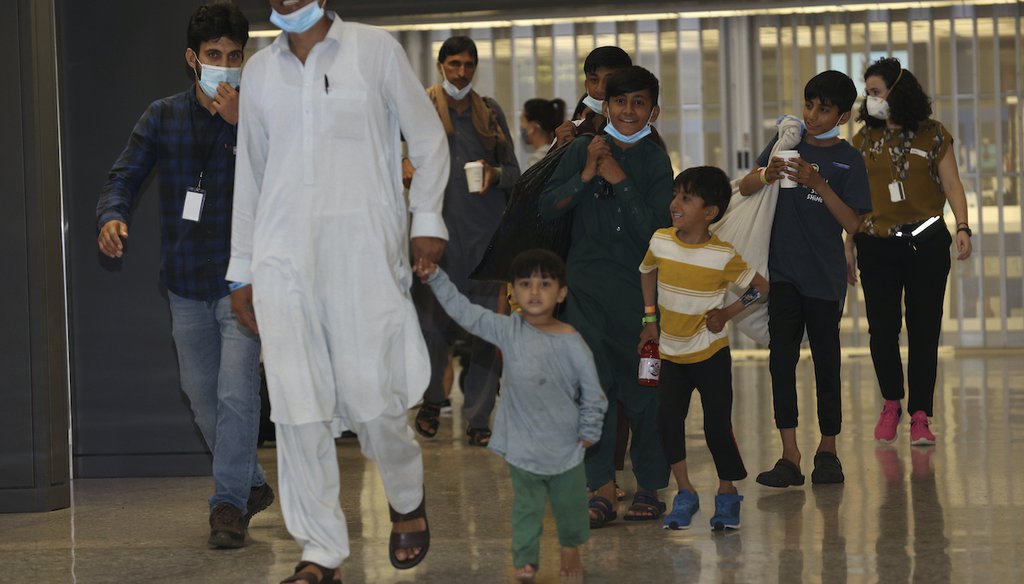 Afghan Refugees arrival at Dulles International Airport as the last planes left Afghanistan after the US withdrawal on August 31, 2021 in Dulles, Virginia. (Associated Press via mpi34/MediaPunch /IPX)