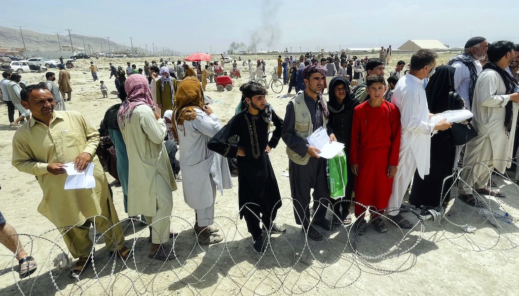 Hundreds of people gather outside the international airport in Kabul, Afghanistan, Tuesday, Aug. 17, 2021. (AP)
