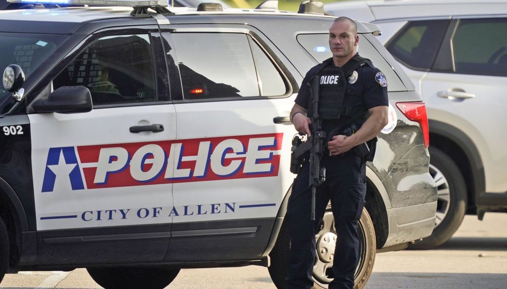 A law enforcement officer guards the entrance to a shopping center after a shooting May 6, 2023, in Allen, Texas. (AP)