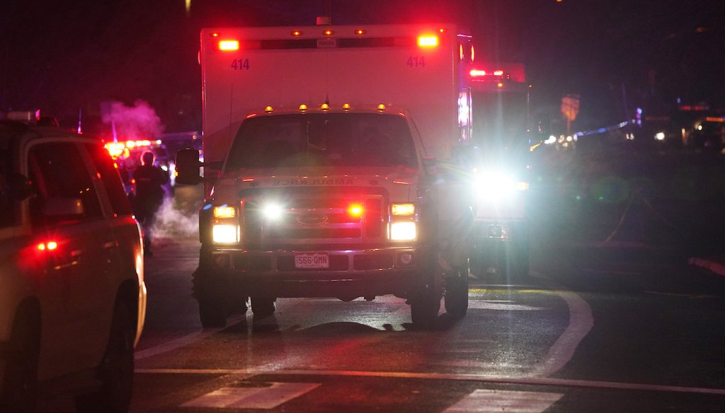 A line of ambulances leaves a King Soopers grocery store where 10 people died in a shooting in Boulder, Colo. (AP Photo/David Zalubowski)