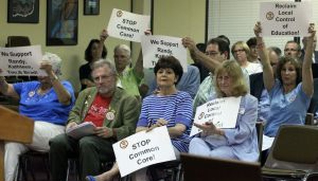 Tea Party members cheer after public comments in favor Cobb County, Ga’s decision not purchase new math textbooks that were aligned with Common Core during a school board meeting in Marietta on Thursday June 27, 2013. (AJC Photo/Phil Skinner)