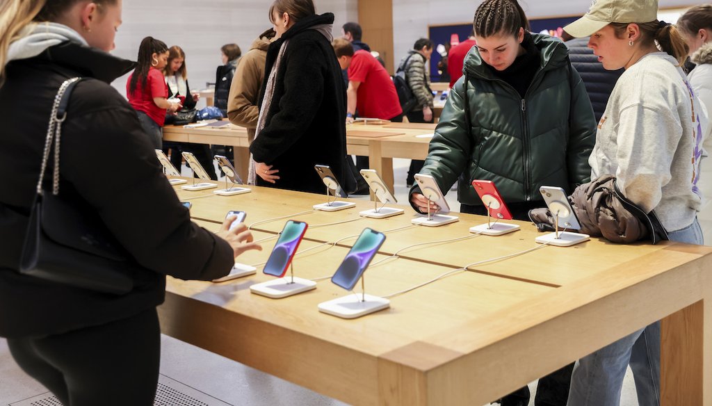 Customers shop in an Apple store on Black Friday, Nov. 25, 2022, in New York. (AP)