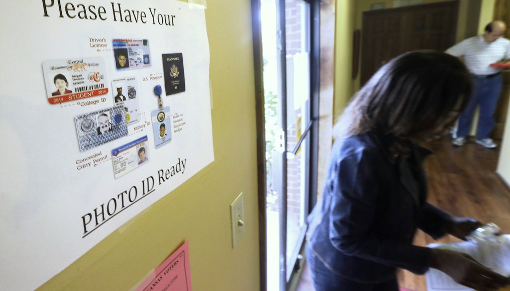 In this May 20, 2014 file photo, an election worker walks past a voter ID sign at a Little Rock, Ark., polling place. (AP)