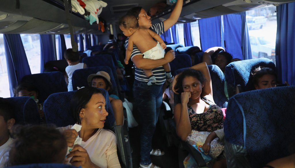 Central American asylum seekers ride a bus to Tijuana on April 25, 2018, while passing through San Luis Rio Colorado along the U.S.-Mexico border. (Getty Images)
