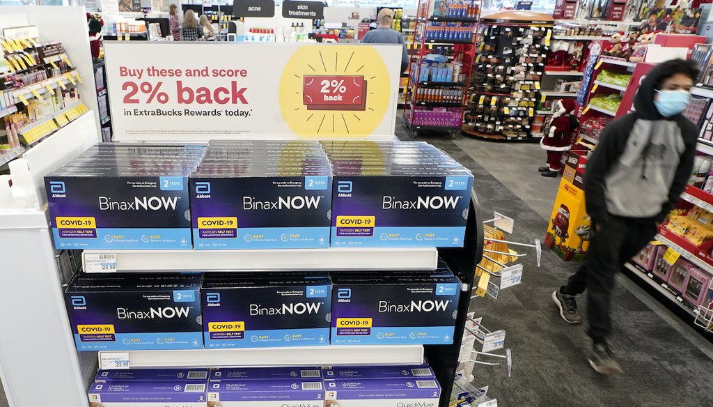 Boxes of BinaxNow home COVID-19 tests made by Abbott and QuickVue home tests made by Quidel are shown for sale Monday, Nov. 15, 2021, at a CVS store in Lakewood, Wash., south of Seattle. (AP)