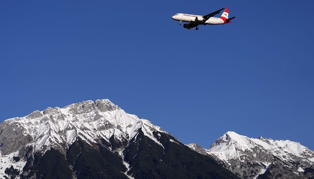 An Austrian Airlines plane flies low over the Alps on approach to Innsbruck airport, Austria, on Jan. 2, 2023. (AP)