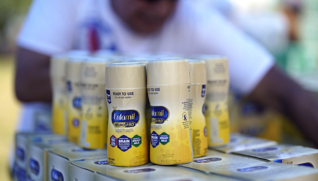 Infant formula is stacked on a table during a baby formula drive to help with the shortage Saturday, May 14, 2022, in Houston.