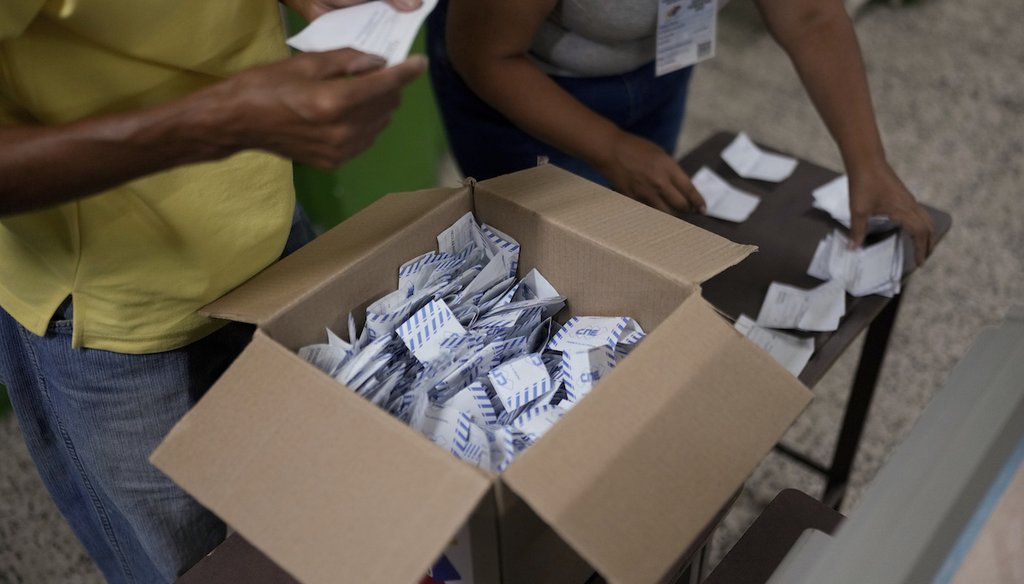 Electoral officials tally votes after polls closed for presidential elections in Caracas, Venezuela, July 28, 2024. (AP)