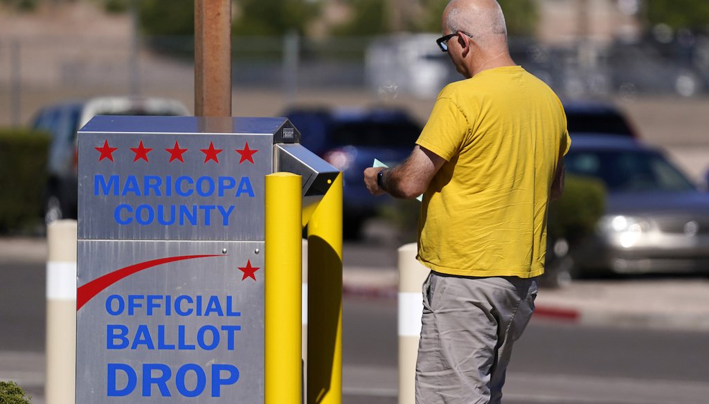 A voter places a ballot in an election voting drop box in Mesa, Ariz.,  Oct. 28, 2022. (AP)