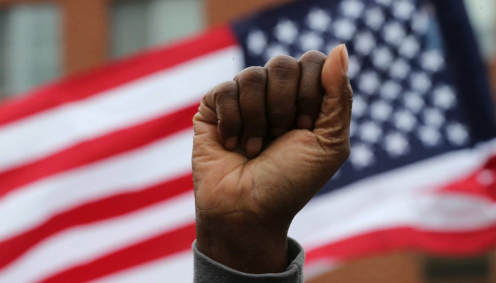 Baltimore residents celebrate after Marilyn Mosby, Baltimore City state's attorney, said six police will be charged in the death of Freddie Gray while in police custody. (Getty Images)