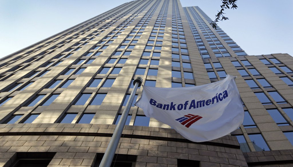 A flag flies in front of Bank of America's corporate headquarters in Charlotte, North Carolina, Oct. 5, 2011. (AP)