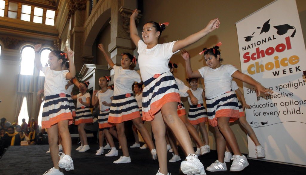 Students from St. Anthony, a voucher school in Milwaukee, perform. Would an expansion of the voucher program cost nearly $2 billion per year?