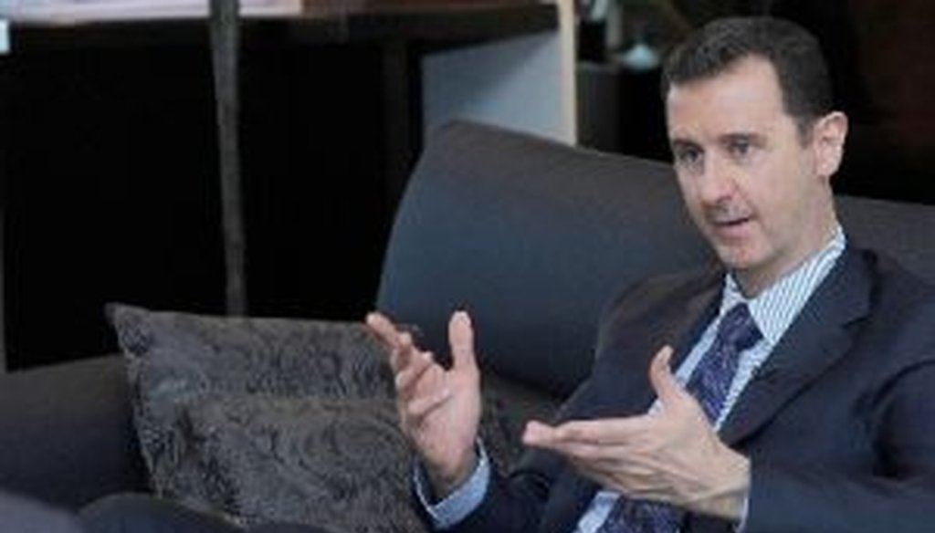 Syrian President Bashar Assad gestures as he speaks during an interview with a Russian newspaper on Aug. 26, 2013. (Handout photo via AP)