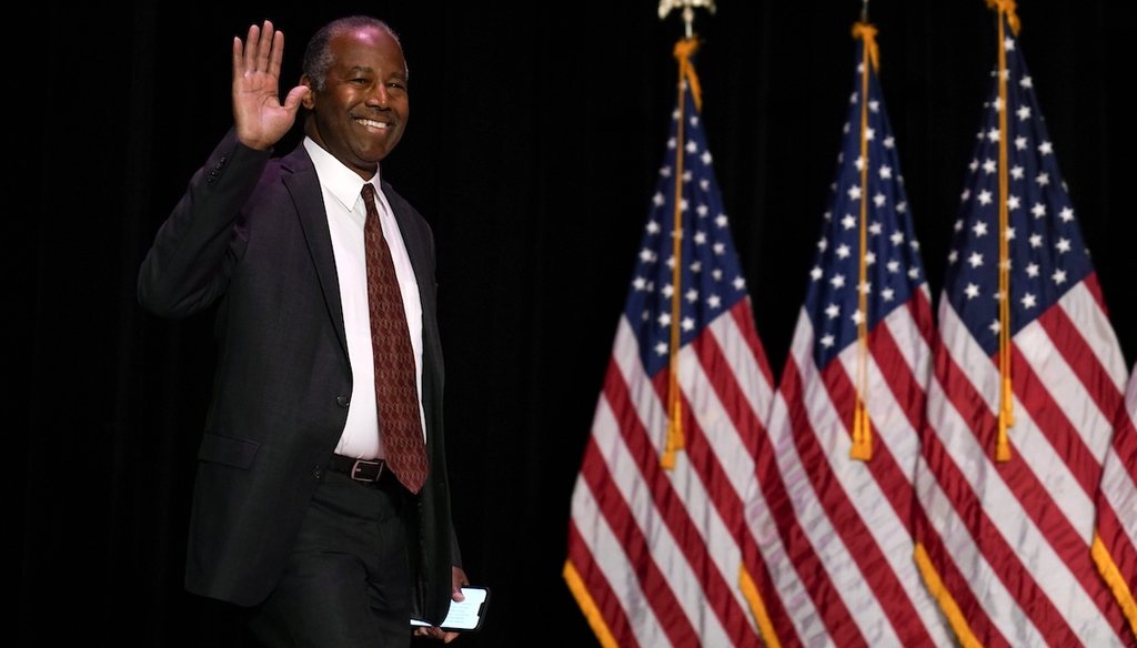 Former Housing and Urban Development Secretary Ben Carson arrives onstage at a former President Donald Trump commit to caucus rally Oct. 29, 2023, in Sioux City, Iowa. (AP)