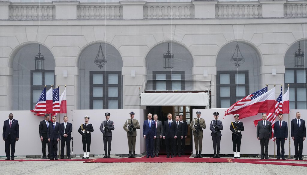 U.S. President Joe Biden, center left, and Polish President Andrzej Duda, center, attend a military welcome ceremony at the Presidential Palace in Warsaw, Poland, on Saturday, March 26, 2022. (AP)