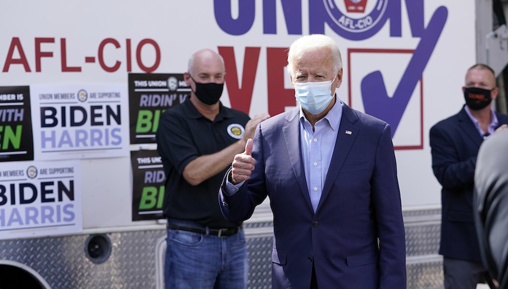 On Labor Day, democratic presidential candidate Joe Biden meets with union leaders outside the AFL-CIO headquarters in Harrisburg, Pa. (AP Photo/Carolyn Kaster)