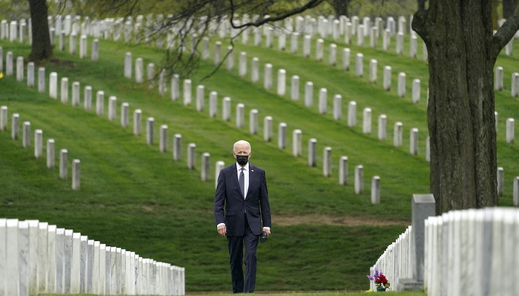President Joe Biden walks in Arlington National Cemetery after announcing the withdrawal of the remainder of U.S. troops from Afghanistan by Sept. 11, 2021. (AP Photo/Andrew Harnik)
