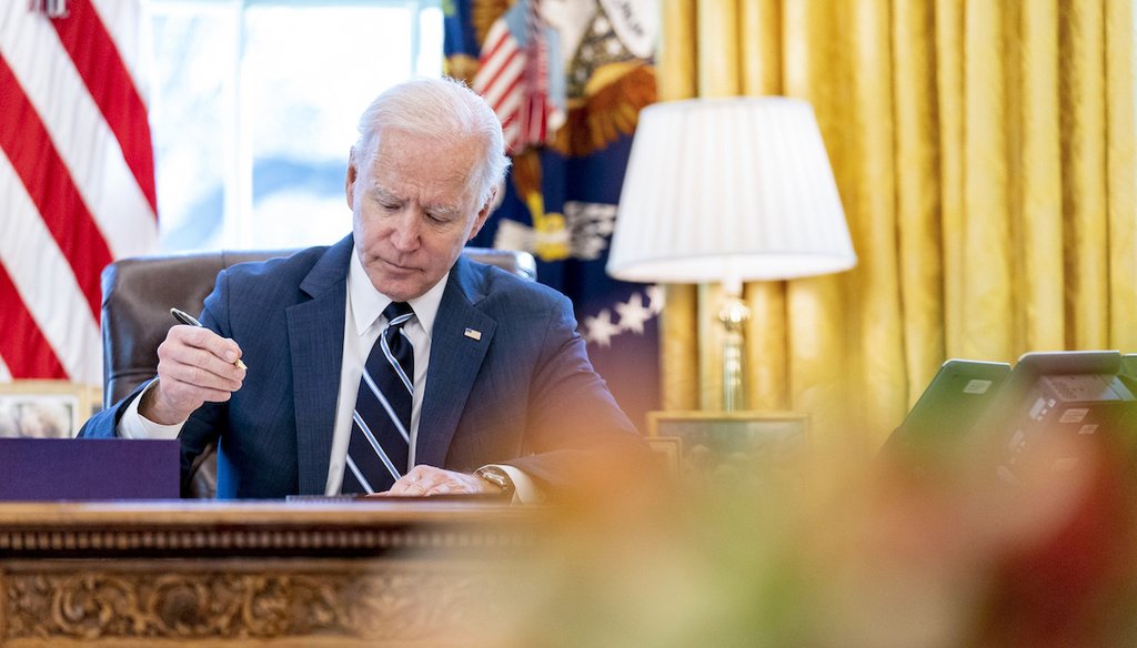 President Joe Biden signs the American Rescue Plan legislation on March 11, 2021. (AP)