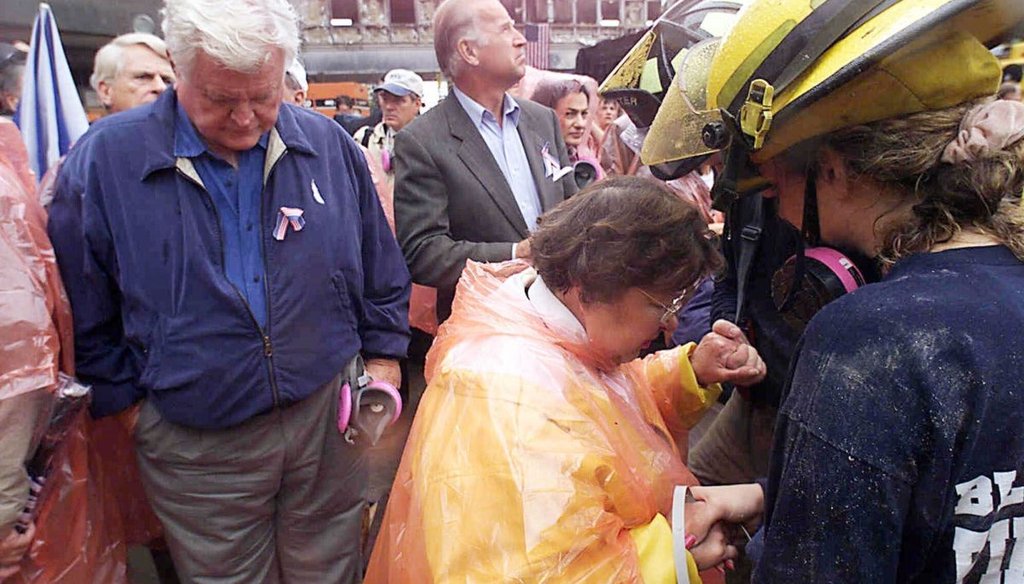 Sen. Ted Kennedy, D-Mass., left, and Sen. Joe Biden, center, stand by as Sen. Barbara Mikulski, D-Md., in orange parka, joins in prayer with rescue workers at the former site of the World Trade Center in New York on Sept. 20, 2001. (AP)