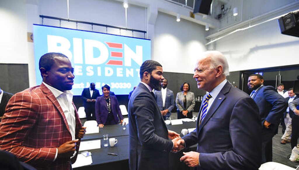 In this Nov. 21, 2019, file photo, former Vice President Joe Biden, right, walks around a meeting with Southern black mayors including Mississippi Mayor Chokwe Lumumba and Virginia Mayor Levar Stoney, in Atlanta. (AP)