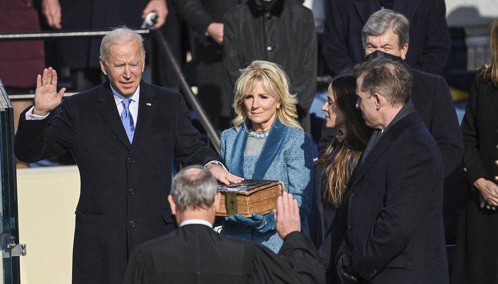 Joe Biden is sworn in as the 46th president of the United States by Chief Justice John Roberts as Jill Biden holds the Bible during the 59th Presidential Inauguration at the U.S. Capitol in Washington, Jan. 20, 2021. (AP)
