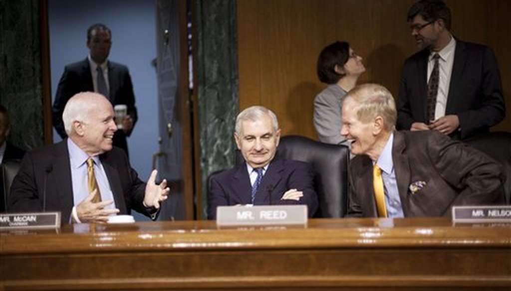 Senate Armed Services Committee Chairman Sen. John McCain, R-Ariz., left, talks with the committee's ranking member, Sen. Jack Reed, D-R.I., center, and Sen. Bill Nelson, D-Fla., right, before the committee's hearing about Iraq on Sept. 16, 2015. (AP)