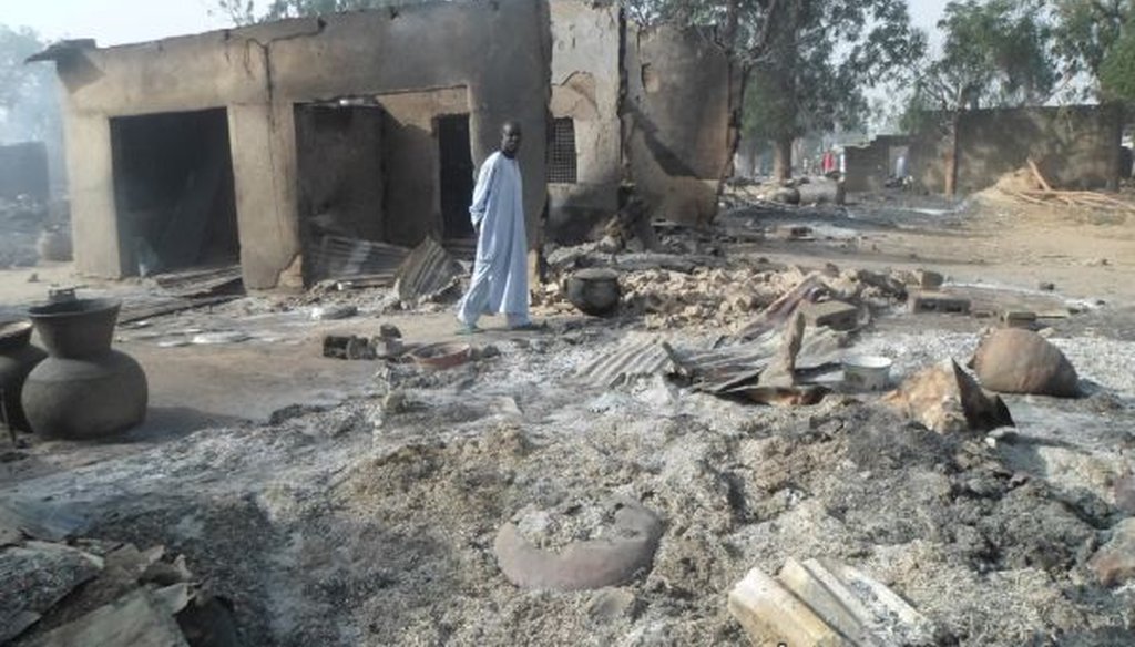 A man walks past burned-out houses following an attack by the Islamic terrorist group Boko Haram near Maiduguri, Nigeria, on Jan. 31, 2016. (AP/Jossy Ola)