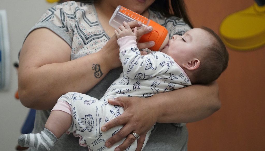 Elizabeth Amador bottle feeds her daughter Destinee, 9 months, at the Ellis R. Shipp Public Health Center Thursday, May 12, 2022, in West Valley City, Utah. The Biden administration is seeking to address a nationwide baby formula shortage. (AP)