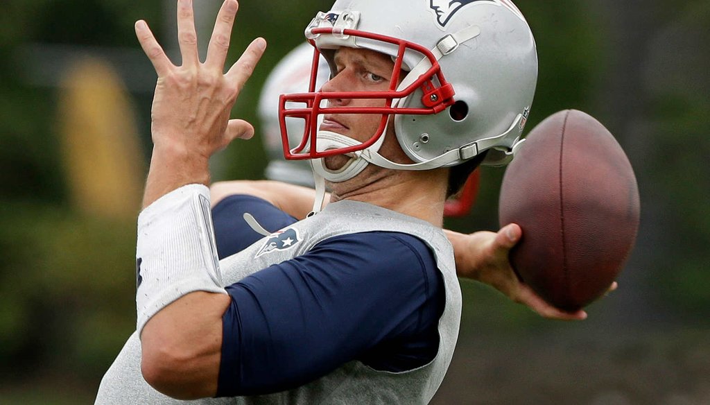 New England Patriots quarterback Tom Brady aims to reverse an NFL penalty for playing with underinflated footballs. (AP photo)