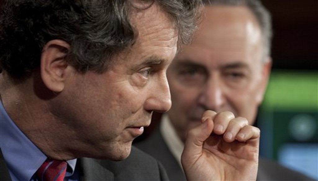 Sen. Sherrod Brown, D-Ohio, left, accompanied by Sen. Charles Schumer, D--N.Y., gestures during a news conference on Capitol Hill in Washington, March 3, 2010. (AP)