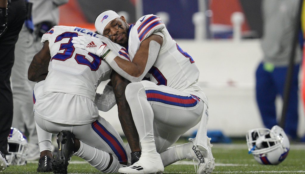 Buffalo Bills' Siran Neal (33) and Nyheim Hines react after teammate Damar Hamlin was injured during the first half of an NFL football game against the Cincinnati Bengals, Jan. 2, 2023, in Cincinnati. (AP)