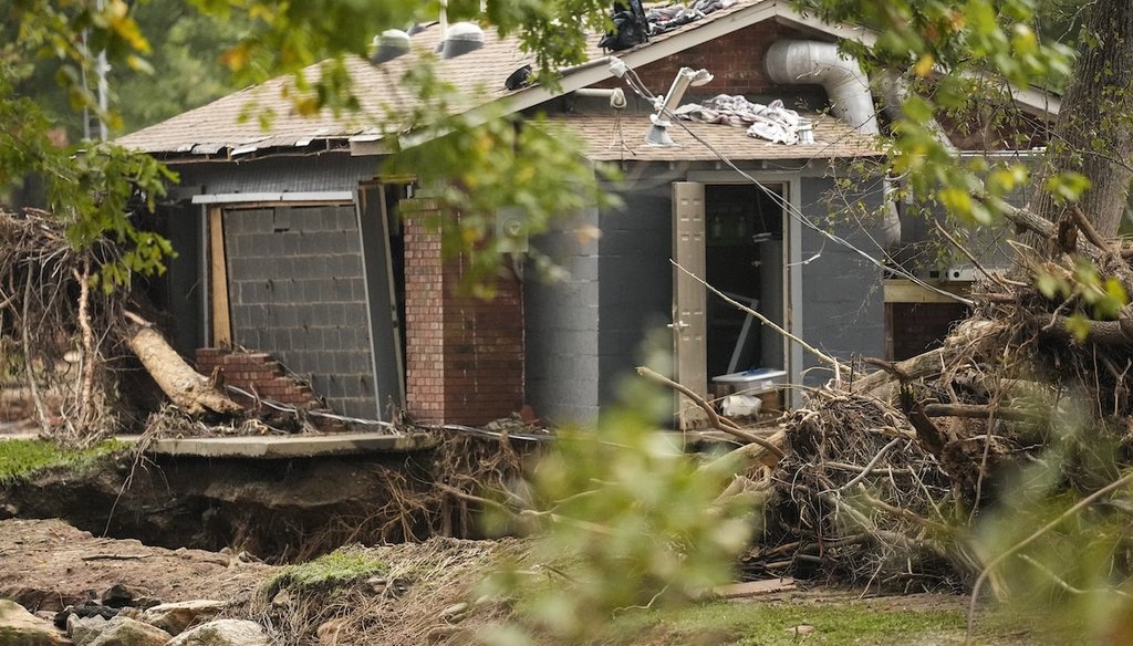 A building was damaged as water rushed over the roof in the aftermath of Hurricane Helene, Oct. 1, 2024, in Swannanoa, N.C. (AP)