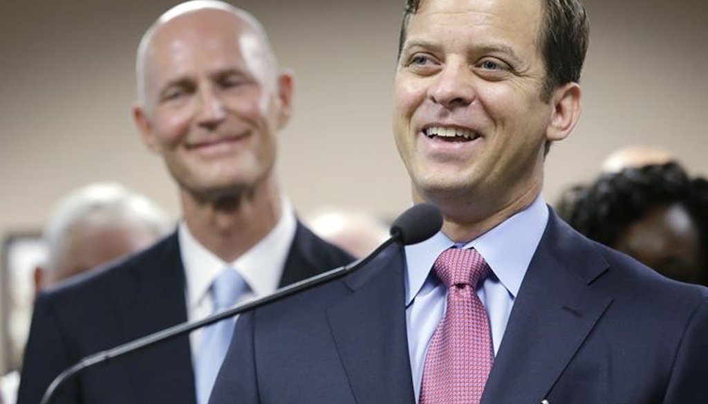Gov. Rick Scott (left) named Carlos Lopez-Cantera as his lieutenant governor in 2014 (Tampa Bay Times).