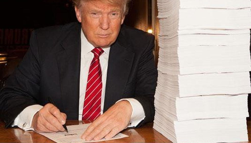 Donald Trump tweeted this picture of himself signing his tax return in October 2015. (Photo via Twitter)