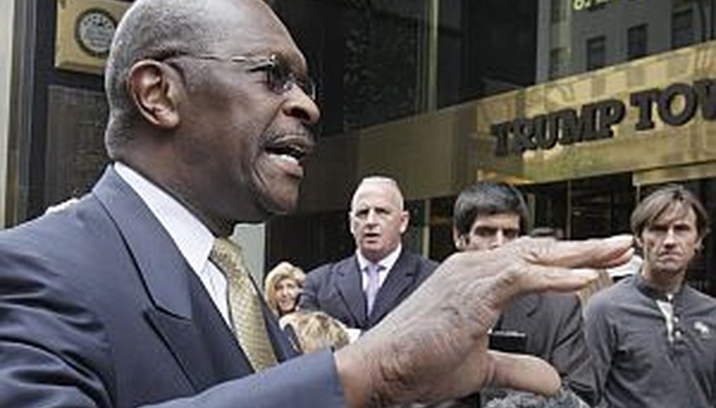 Herman Cain speaks to the press before his Monday meeting with real estate mogul Donald Trump in Manhattan
