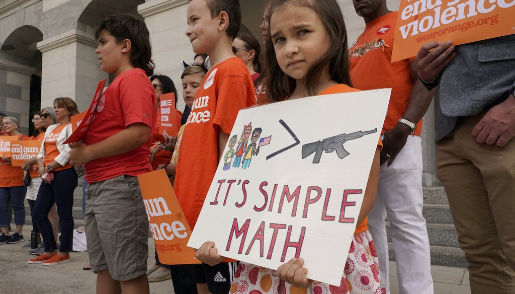 Elise Schering, 7, displays a message during a National Gun Violence Awareness rally at the Capitol in Sacramento, Calif., June 2, 2022. Gov. Gavin Newsom announced that California is spending $11 million to promote use of red flag laws. (AP)