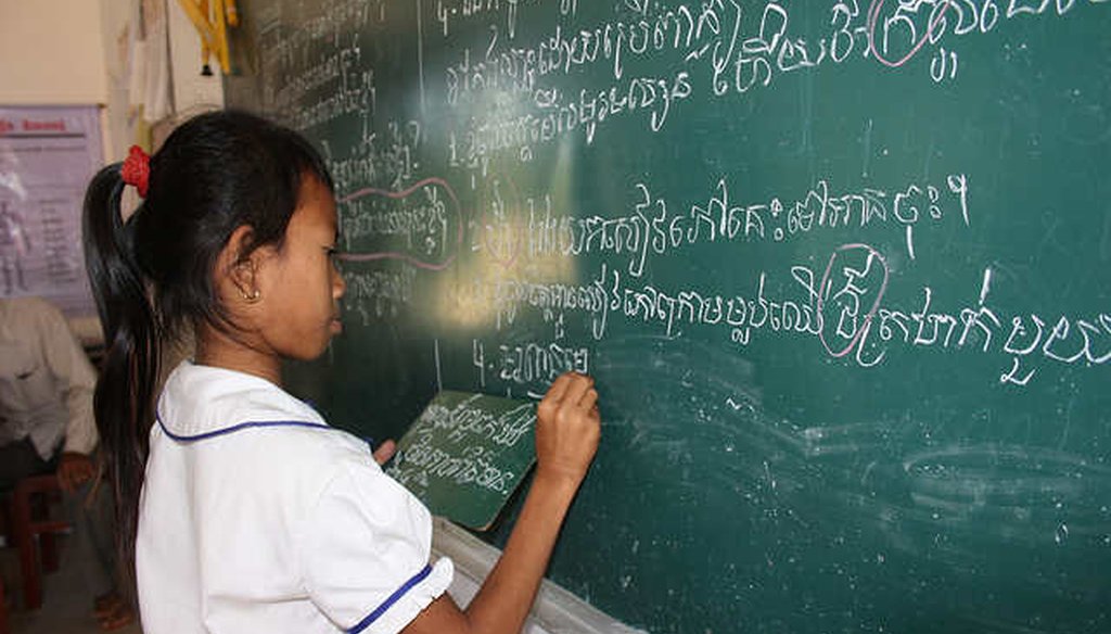 A girl completes an exercise at a school in Cambodia (Global Partnership for Education)