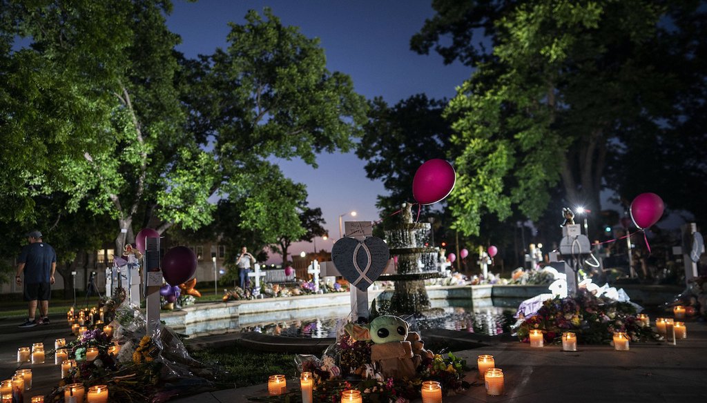 Candles are lit at dawn on May 27, 2022 at a memorial site in the town square for the victims killed at an elementary school shooting in Uvalde, Texas. (AP)