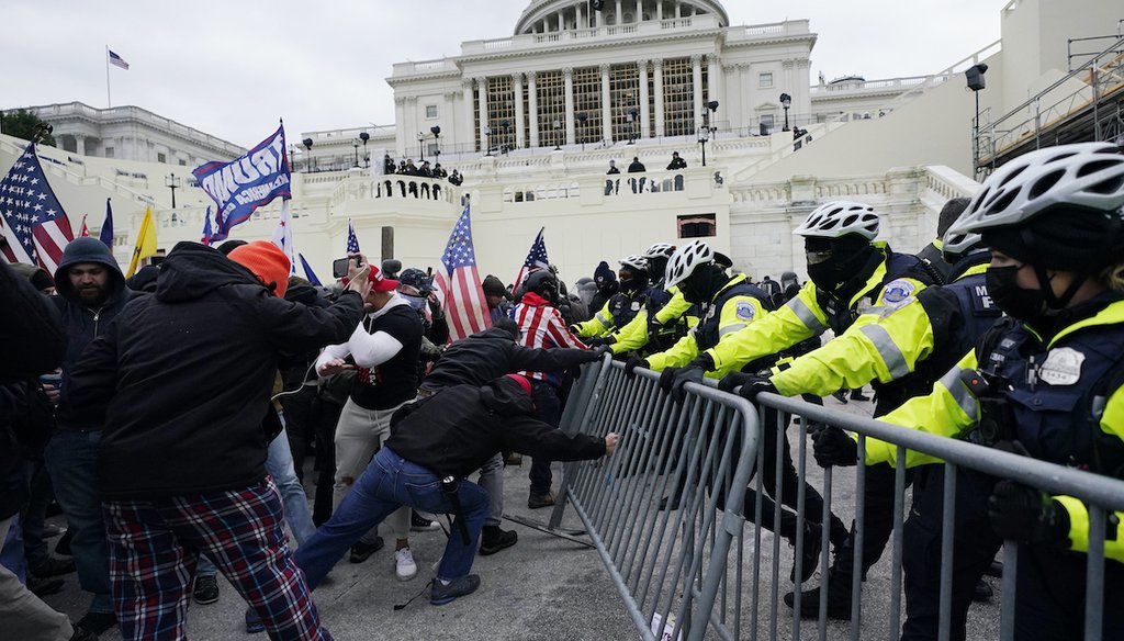 In this Jan. 6, 2021 file photo, Trump supporters try to break through a police barrier at the Capitol in Washington. (AP)