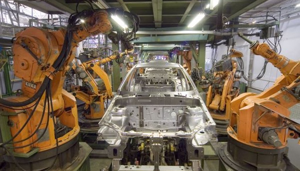 Robots are widely used in automobile manufacturing, but the number of human workers has been rising recently, too. (Wikimedia Commons)