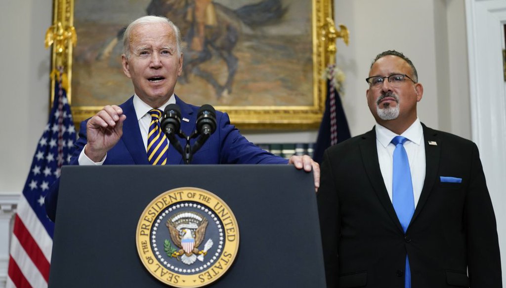 President Joe Biden speaks about student loan debt forgiveness at the White House on Aug. 24, 2022. Education Secretary Miguel Cardona listens at right. (AP)