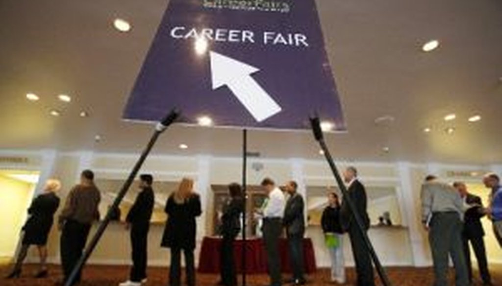 A line forms at a career fair in San Jose, Calif. The federal jobs report released on July 8, 2011, offered only grim numbers to Americans hoping for signs of a sustained recovery.