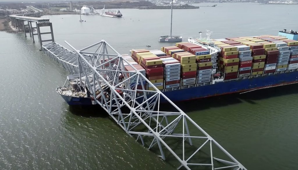 In this image taken from video released by the National Transportation and Safety Board, the cargo ship Dali is stuck under part of the structure of the Francis Scott Key Bridge after the ship hit the bridge, March 26, 2024, in Baltimore. (AP)