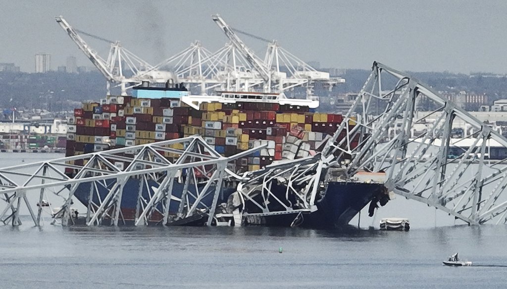 A cargo ship is stuck under the part of the structure of the Francis Scott Key Bridge after the ship hit the bridge March 26, 2024, in Baltimore, Md. (AP)