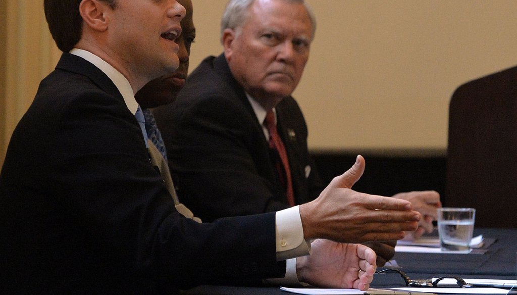 Republican Gov. Nathan Deal and his Democratic rival, state Sen. Jason Carter, answer questions during an educational forum on Sept. 15, 2014. The two are locked in a near-tie in the 2014 race for governor. Photo by KENT D. JOHNSON / KDJOHNSON@AJC.COM