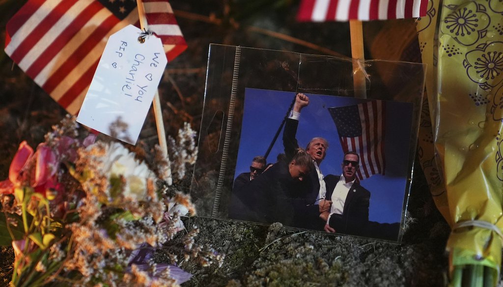 A photo of President Donald Trump is seen at a growing memorial for Charlie Kirk outside Timpanogos Regional Hospital after Kirk was shot and killed Sept. 10, 2025, in Orem, Utah. (AP)