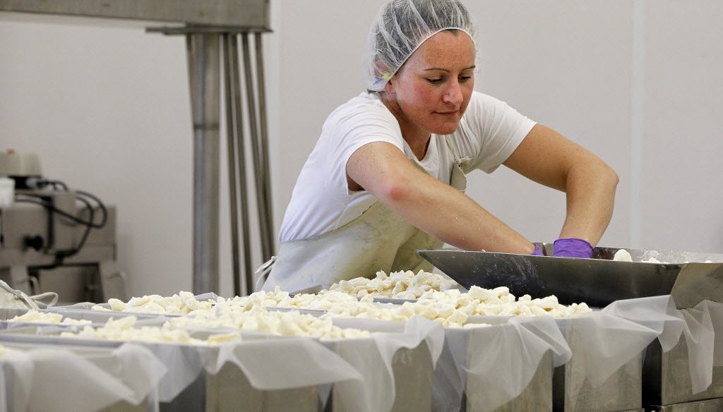 Cara Wagner works in the cheese making room at LaClare Farms, a dairy goat farm near Malone, Wis.